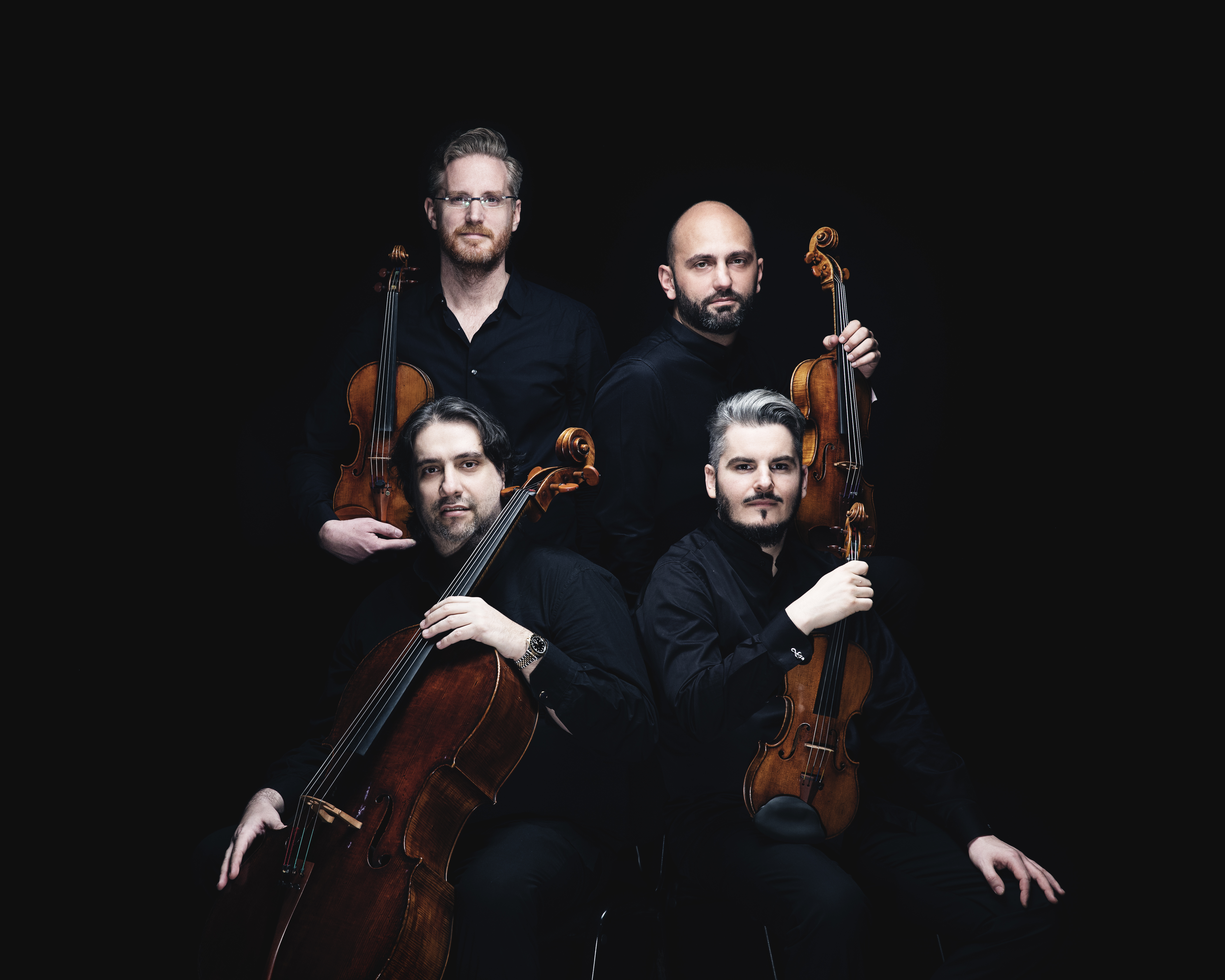 Foto des Quartetto di Cremona: Vier Musiker mit ihren Instrumenten. Foto: Nikolay Lund
